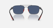 Sunglasses front view with dark blue mirrored lenses, gunmetal frame and red temple tips