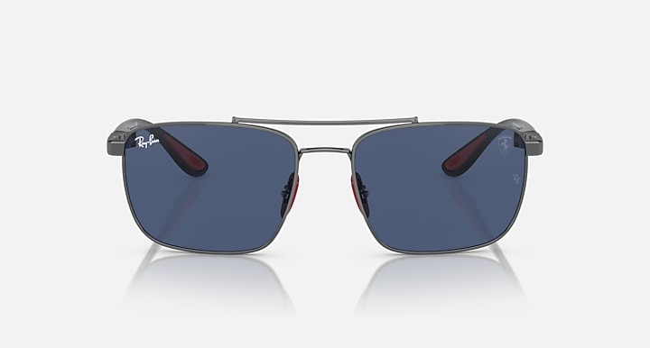 Square sunglasses with dark blue mirrored lenses, gunmetal frame, red temple accents