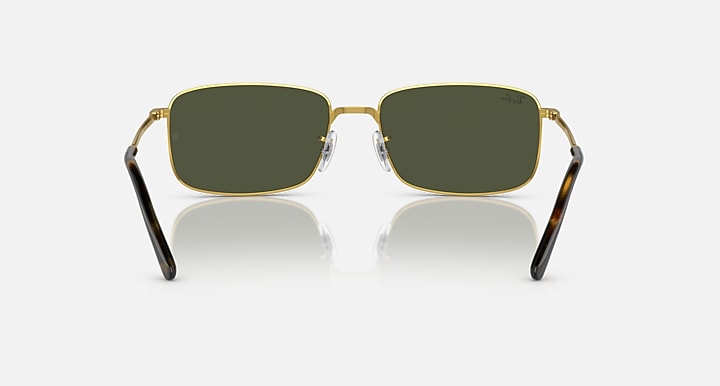Gold-framed square sunglasses with dark green lenses and thick black temple arms