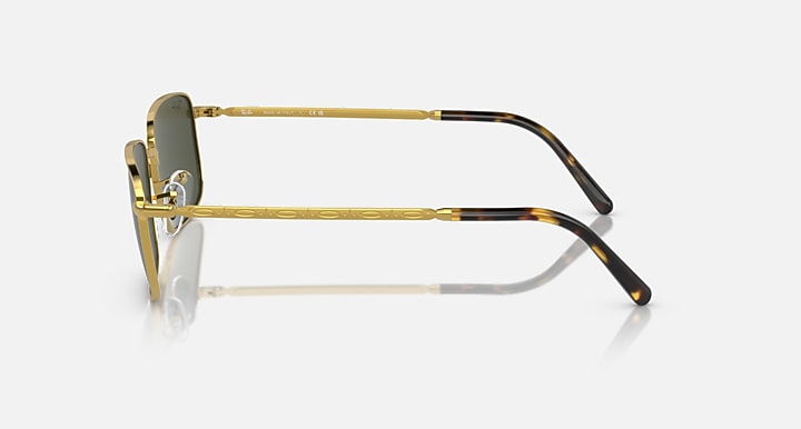 Gold and black temple sunglasses with rectangular lenses, side profile
