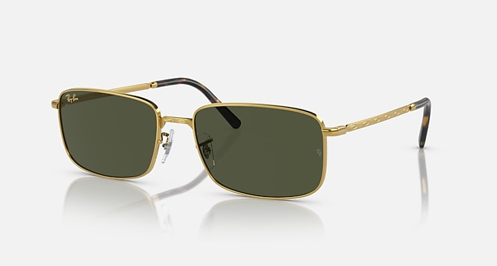 Gold-framed square sunglasses with dark green lenses and black temple tips