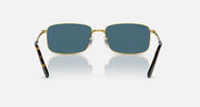 Gold-framed square sunglasses with blue-tinted lenses and thick black temple arms