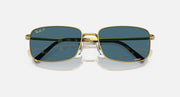Gold-framed square sunglasses with dark blue lenses and metal bridge detail