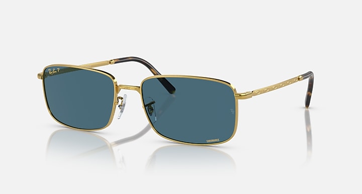 Gold-framed square sunglasses with blue-tinted lenses and black temple tips