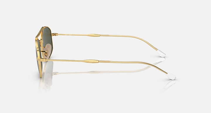 Ray-Ban sunglasses with gold metal frame and clear lenses, side view