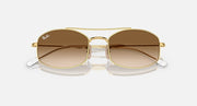 Ray-Ban square sunglasses with gold frame and amber gradient lenses, slight angled view