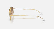 Ray-Ban sunglasses with gold metal frame and clear lenses, side view
