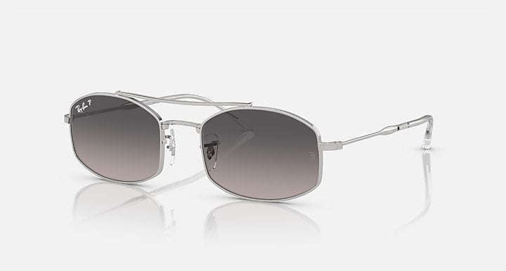 Ray-Ban sunglasses with gradient lenses and clear frame with silver accents