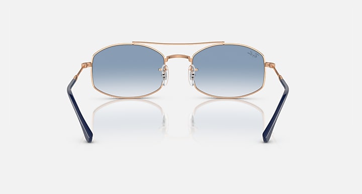 Ray-Ban RB3719 sunglasses with blue gradient lenses and rose-gold frame, navy temples