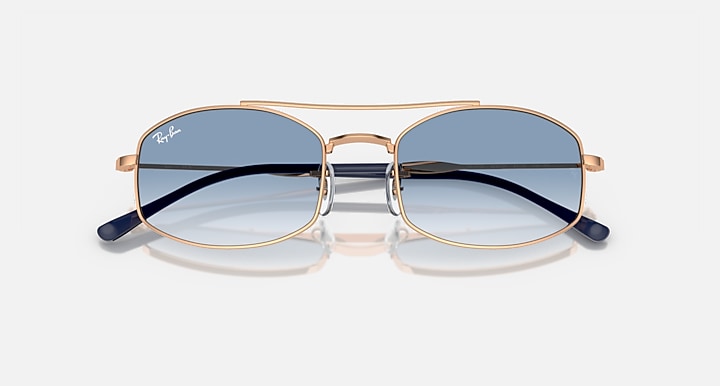 Ray-Ban RB3719 sunglasses with blue gradient lenses and rose-gold frame, front view