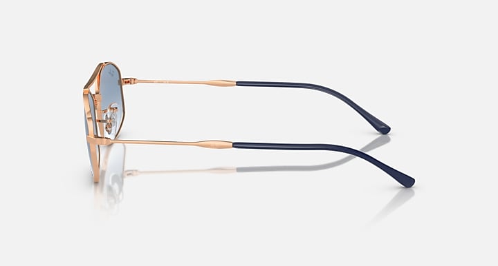Ray-Ban RB3719 sunglasses with rose-gold frame and navy temples, side view
