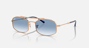 Ray-Ban RB3719 sunglasses with blue gradient lenses and rose-gold metal frame