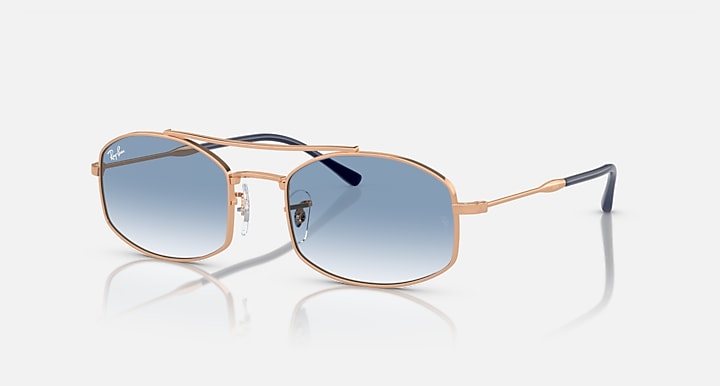 Ray-Ban RB3719 sunglasses with blue gradient lenses and rose-gold metal frame