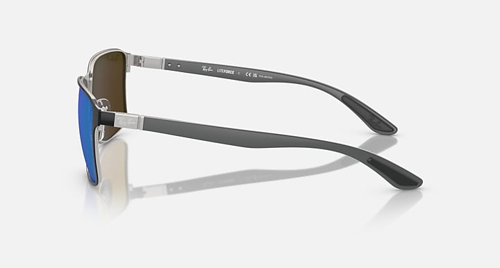 Ray-Ban Chromance side view sunglasses with blue lenses, dark frame, metal temple arms