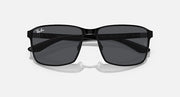 Rectangular square sunglasses with black frame and dark tinted lenses