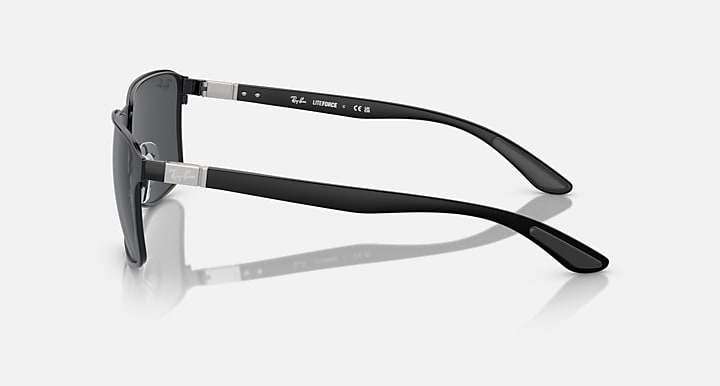 Side-view square sunglasses with matte black frame and dark grey tinted lenses