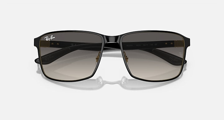 Square sunglasses with black frame and brown-tinted gradient lenses