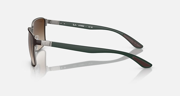 Ray-Ban side view sunglasses with dark green temples and brown tinted lenses