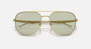 Gold aviator sunglasses with light green tinted lenses and dark-tinted upper band