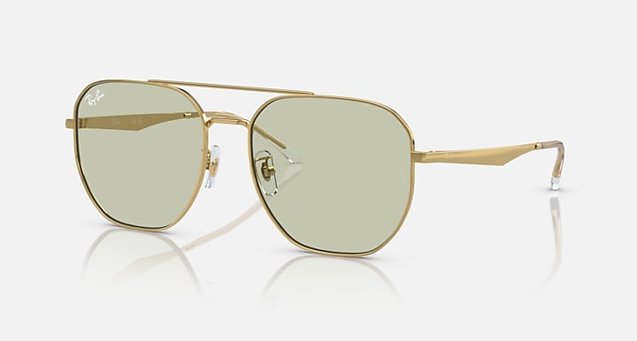 Gold aviator sunglasses with light green tinted lenses and metal bridge