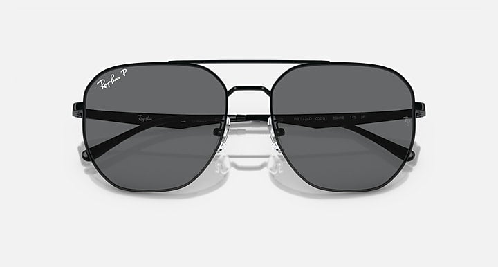 Ray-Ban aviator sunglasses with dark grey lenses and black frame, front view