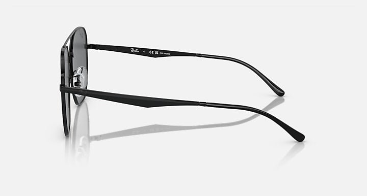 Ray-Ban aviator sunglasses, side view with black frame and dark lenses