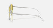 Ray-Ban aviator sunglasses with yellow-tinted lenses and silver-tone frame, side profile