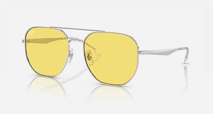 Ray-Ban aviator sunglasses with yellow mirrored lenses and gold-tone frame, side view