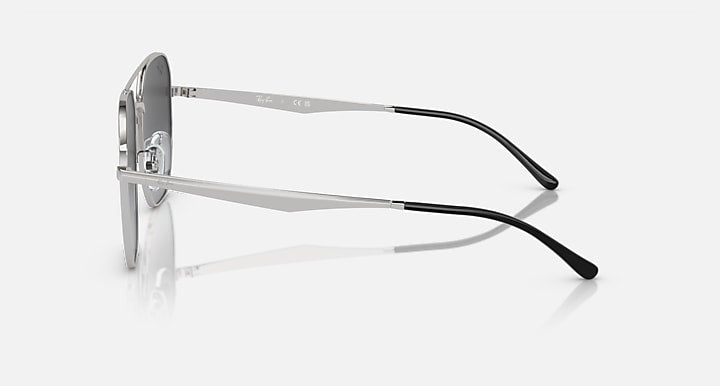 Ray-Ban aviator sunglasses, side view with silver frame and dark lenses