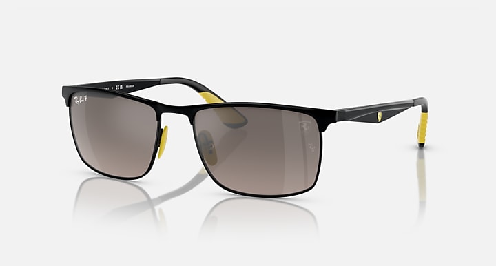 Black rectangular sunglasses with dark lenses and yellow temple accents