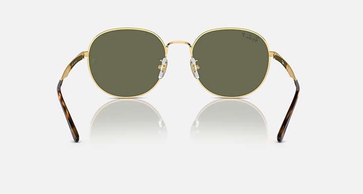 Round gold sunglasses with dark olive lenses and curved patterned temples