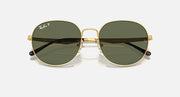 Round gold sunglasses with dark green-tinted lenses and metal bridge