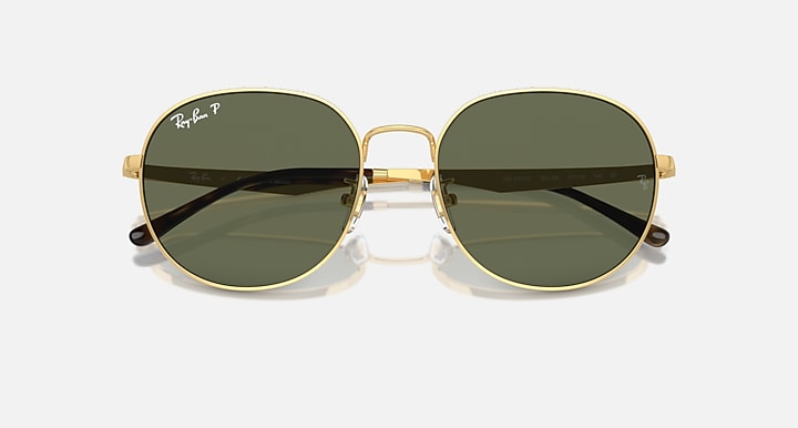 Round gold sunglasses with dark green-tinted lenses and metal bridge