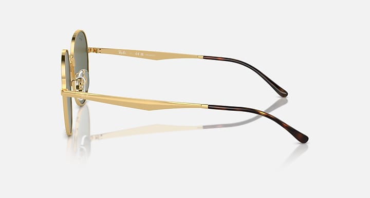 Gold round sunglasses, side view with thin metal frame and dark tips