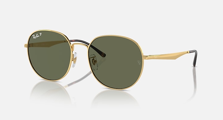 Round gold sunglasses with dark olive lenses and thin metal temples