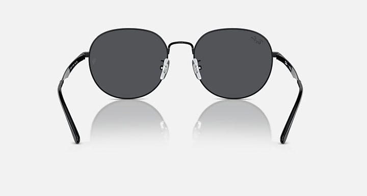 Round black sunglasses with dark gray lenses and curved temple arms