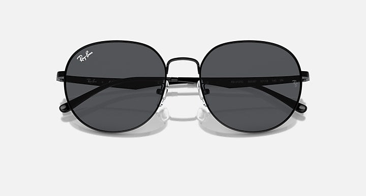 Round black sunglasses with dark gray tinted lenses and metal bridge