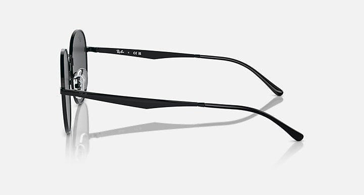 Black round sunglasses, side view with slim frame and angled temples