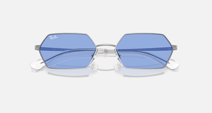 Hexagonal blue mirrored sunglasses with silver frame and central bridge
