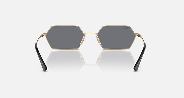 Hexagonal dark mirrored sunglasses with gold frame and black temples