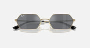 Hexagonal dark mirrored sunglasses front view with gold frame and Ray-Ban logo