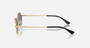 Hexagonal sunglasses side view with dark lens and light gold frame, black tips