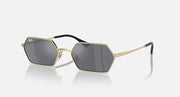 Hexagonal dark mirrored sunglasses with light gold frame and black temples