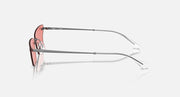 Ray-Ban coral pink sunglasses, side profile with silver metal arms and orange lens