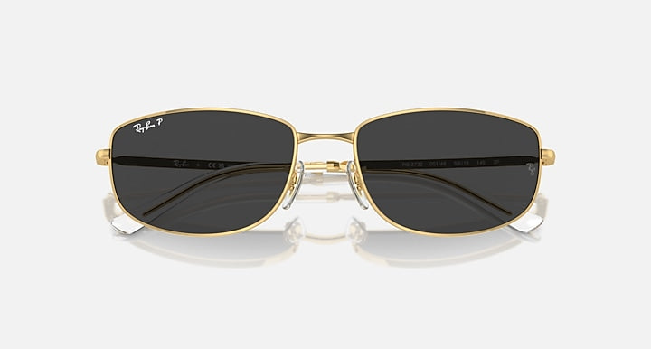 Gold-tone sunglasses with dark (black) mirrored lenses and rectangular frames