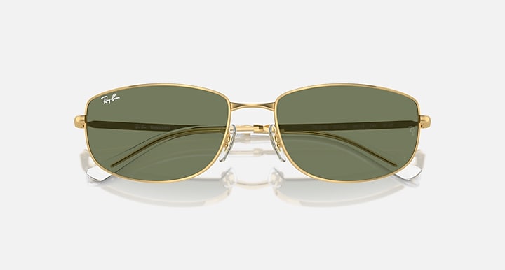 Gold metal sunglasses with dark green tinted lenses and rounded rectangular shape