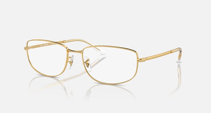 Gold metal frame sunglasses with clear lenses and rectangular wrap silhouette