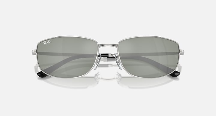Silver sunglasses with gray-green gradient lenses and rounded rectangular shape