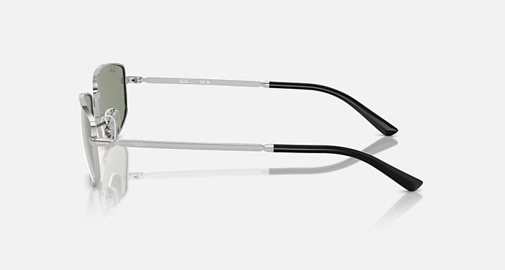 Silver sunglasses side view with dark lens and black temple tips