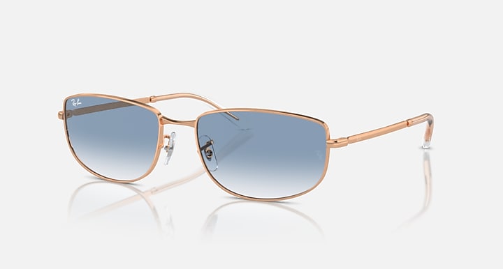 Rose gold sunglasses with blue mirrored lenses and thin metal frame